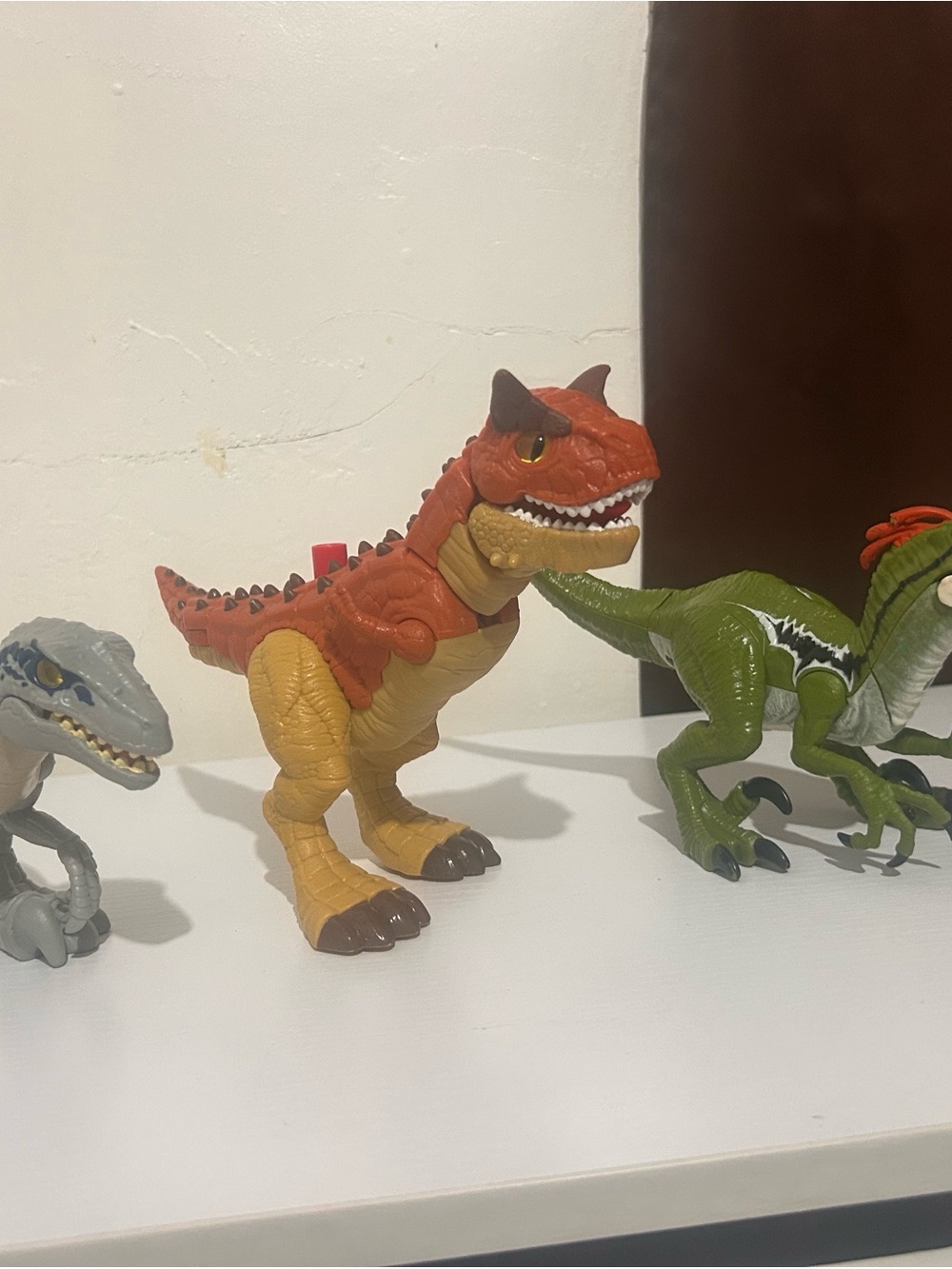 Red and Tan Dinosaur Action Figure with Realistic Details